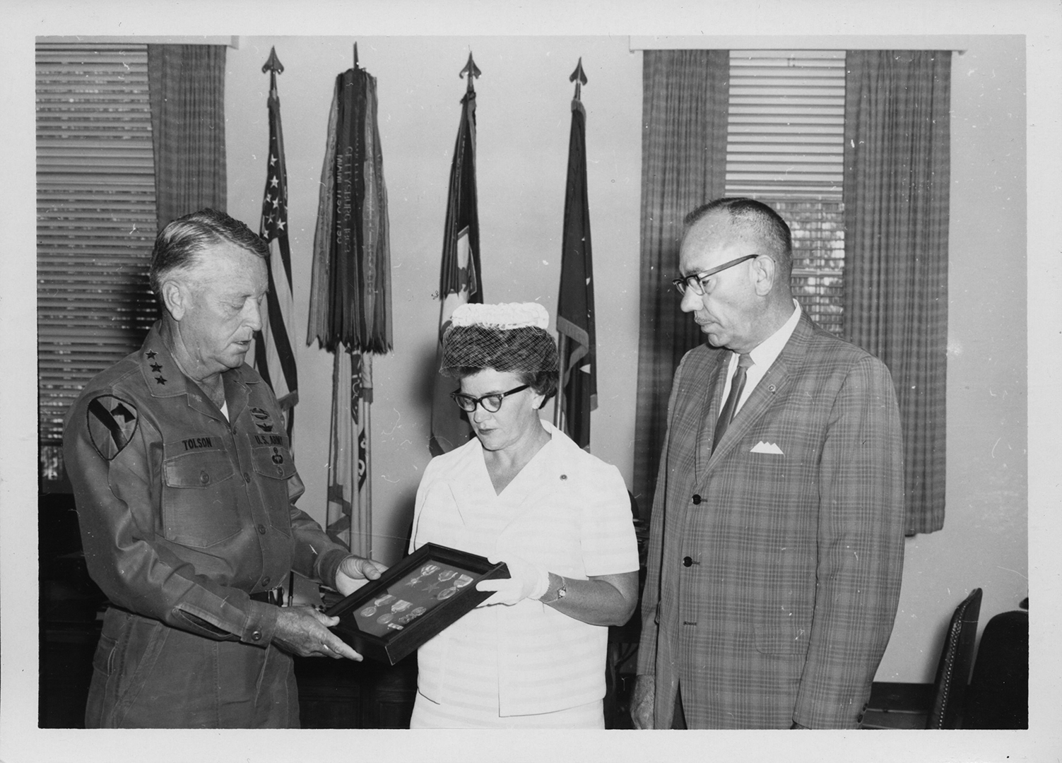 Lieutenant General John J. Tolson, Commanding
        General XVIII Airborne Corps, presents the Silver
        Star and Bronze Medal posthumously to Glanor
        Gay Best and Hugh Best Jr., who are receiving the
        medals on behalf of their deceased son, Hugh E.
        Best III, who was killed in action in 1969 in the
        Vietnam War. (Credit: C. Gene Tyree, 20 June 1969)
